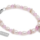 Kinder armbandje 'Infinity' met lief bol hartje en Swarovski kristallen Dit armbandje is een waar pronkstukjes: Glinsterende AAA-kwaliteit ivoorwitte pareltjes afgewisseld met Swarovski kristallen en lieve ringetjes. Aan het armbandje hangt een bol hartje, symbolisch voor het liefste meisje!